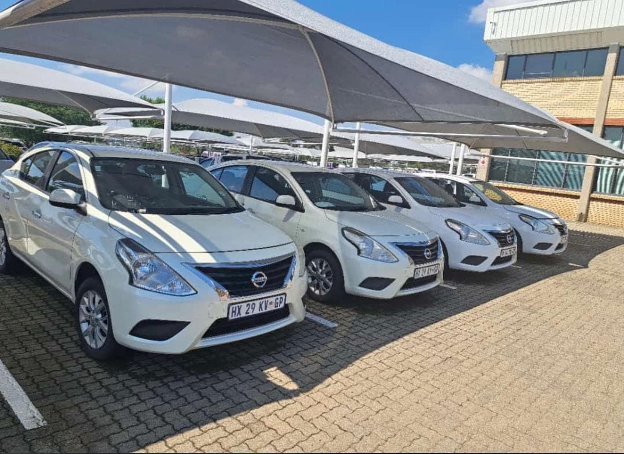 A container ship at a busy port, symbolizing global logistics.
